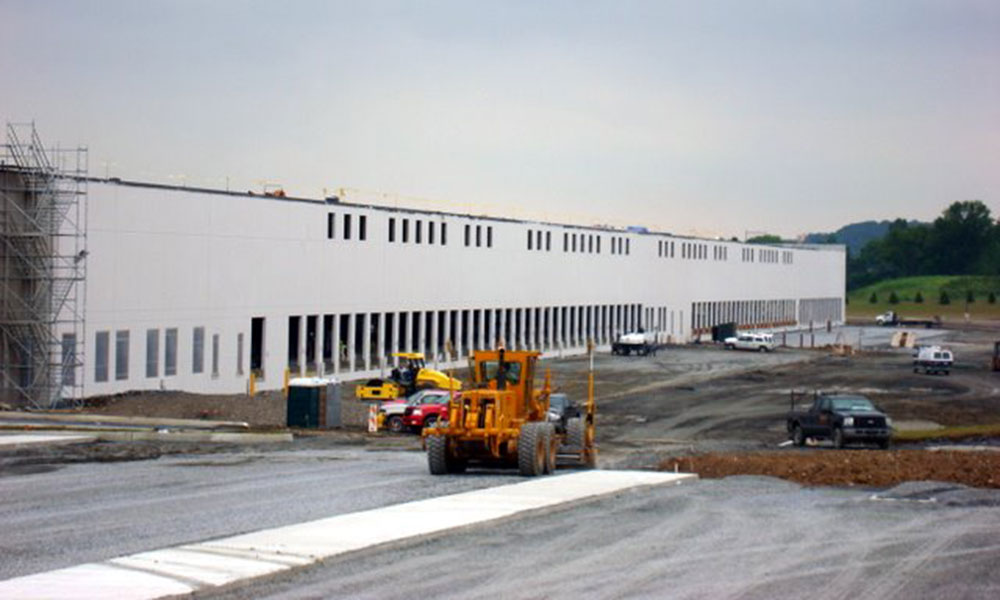 warehouse exterior under construction with equipment