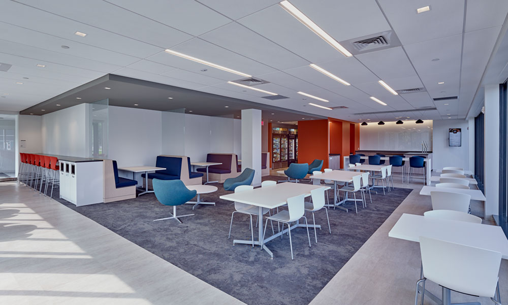 Interior of a cafeteria and seating area of a modern office building