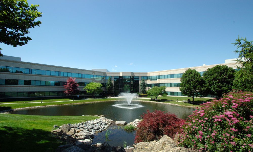 Chesterbrook Corporate Center wide angle full exterior view with fountain in front of the building