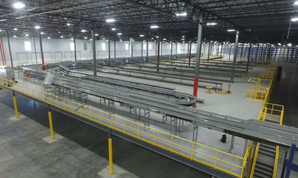 multiple conveyor lines inside an industrial warehouse