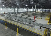 multiple conveyor lines inside an industrial warehouse